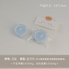 Round tealight candle, light blue (scent: bluebell)