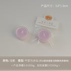 Round tealight candle, light purple (scent: oregano and narcissus)